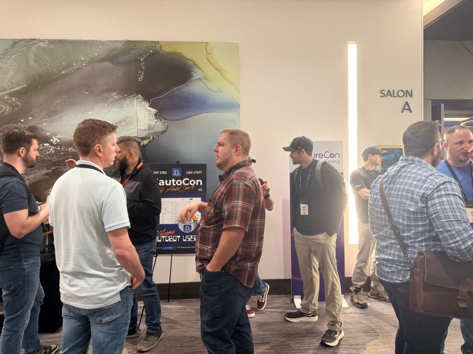 Attendees networking at NautoCon Austin 2025